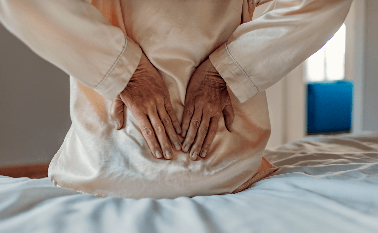 Vrouw wordt wakker met rugpijn